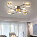 Ambre Simple Atmosphere Chandelier - hanging over living room seating