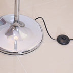 Cascade crystal floor lamp switched on at dusk
