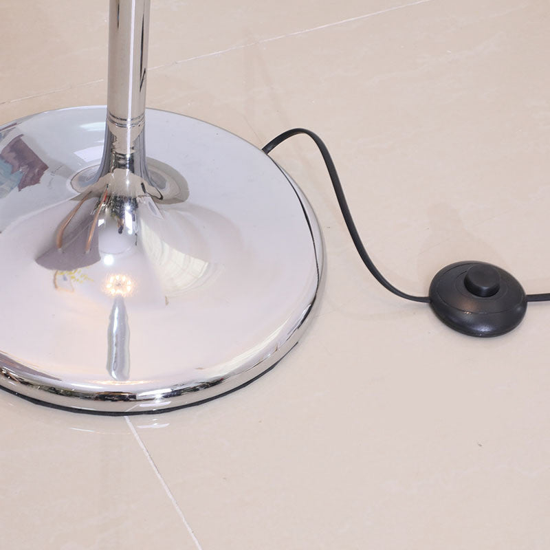 Cascade crystal floor lamp switched on at dusk
