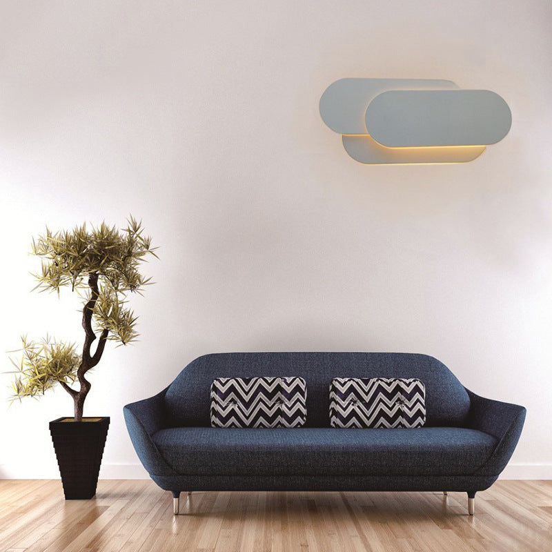 Facette Acrylic Sconce Wall Light - illuminated warm glow at dusk