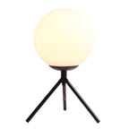 Filaire gold iron wireframe table lamp on a shelf