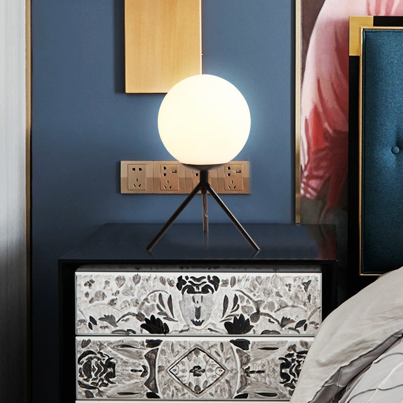 Filaire gold table lamp styled in a minimalist interior