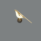 Corvus Sculptural Bird Wall Sconce - mounted on living room wall