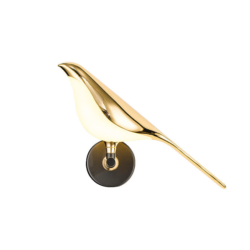Corvus Sculptural Bird Wall Sconce - illuminated warm glow at dusk