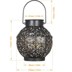 Jardin Wrought-Iron Solar Garden Lantern - illuminated warm glow at dusk