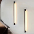 Tête de Lit minimalist headboard sconce above a bed