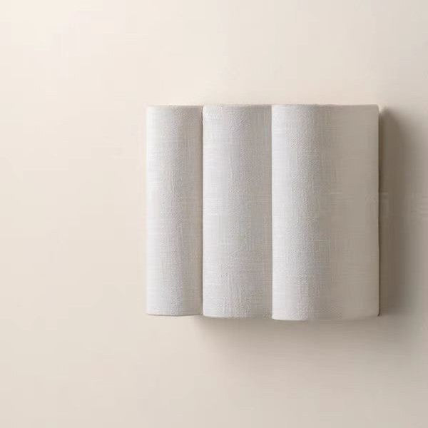 Vague sconce switched on, warm glow