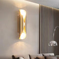 Solstice Marble-Finish Wall Sconce - mounted above living room console