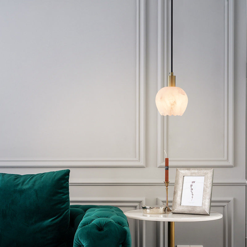 Petit Cuivré lamp switched on, warm glow