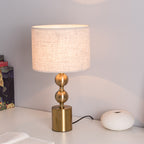 Lumière d'Or Gold Desk Lamp - base detail on wood desk
