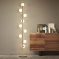 Sphère sofa ball floor lamp arching over a sofa