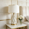 Alvéole ceramic honeycomb table lamp on a console table