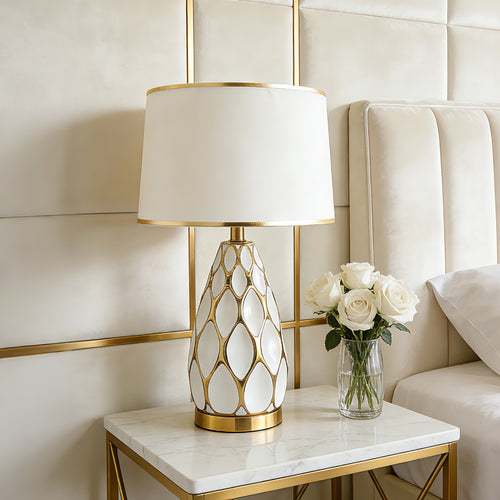 Alvéole ceramic honeycomb table lamp on a console table