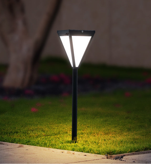 Villa Minimaliste ground light in a flower bed