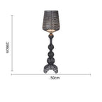 Ajour Sculptural Hollow Floor Lamp - evening living room lifestyle setting