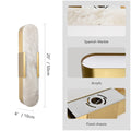 Marbre Doré marble and gold sconce duo flanking a mirror