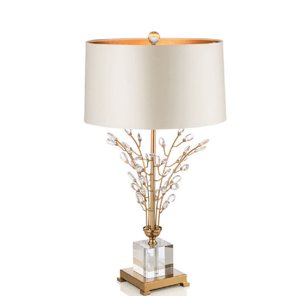 Cristalys crystal lamp styled on a sideboard