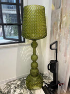 Ajour Sculptural Hollow Floor Lamp - full silhouette beside sofa