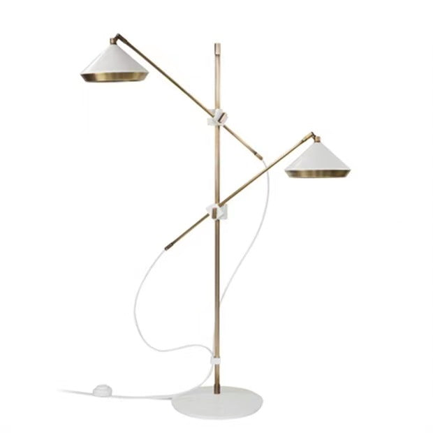 Showroom lamp styled beside a sofa