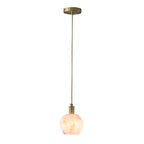 Petit Cuivré lamp styled above a bedside table