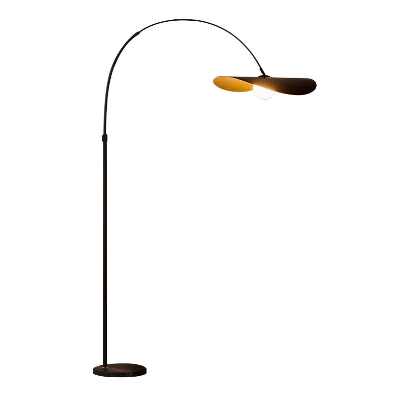 Chapeau lamp styled beside a sofa