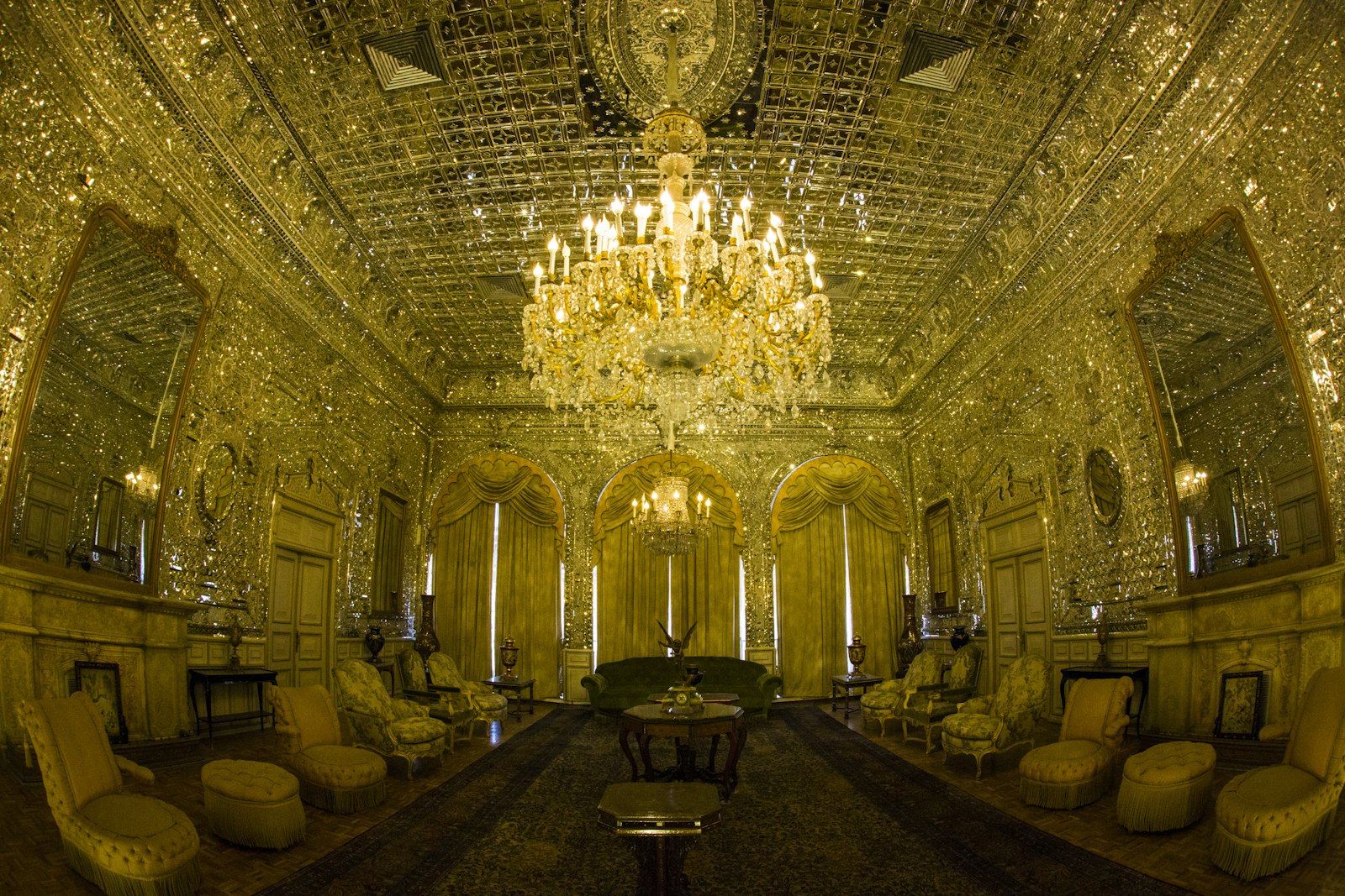 Regal K9 Crystal Tiered Chandelier as the centerpiece of a formal dining room