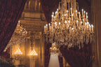 Regal K9 Crystal Tiered Chandelier lifestyle detail view, as the centerpiece of a formal dining room